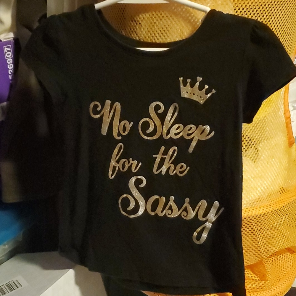 Black shirt with ( no sleep for tje Sassy) on it
